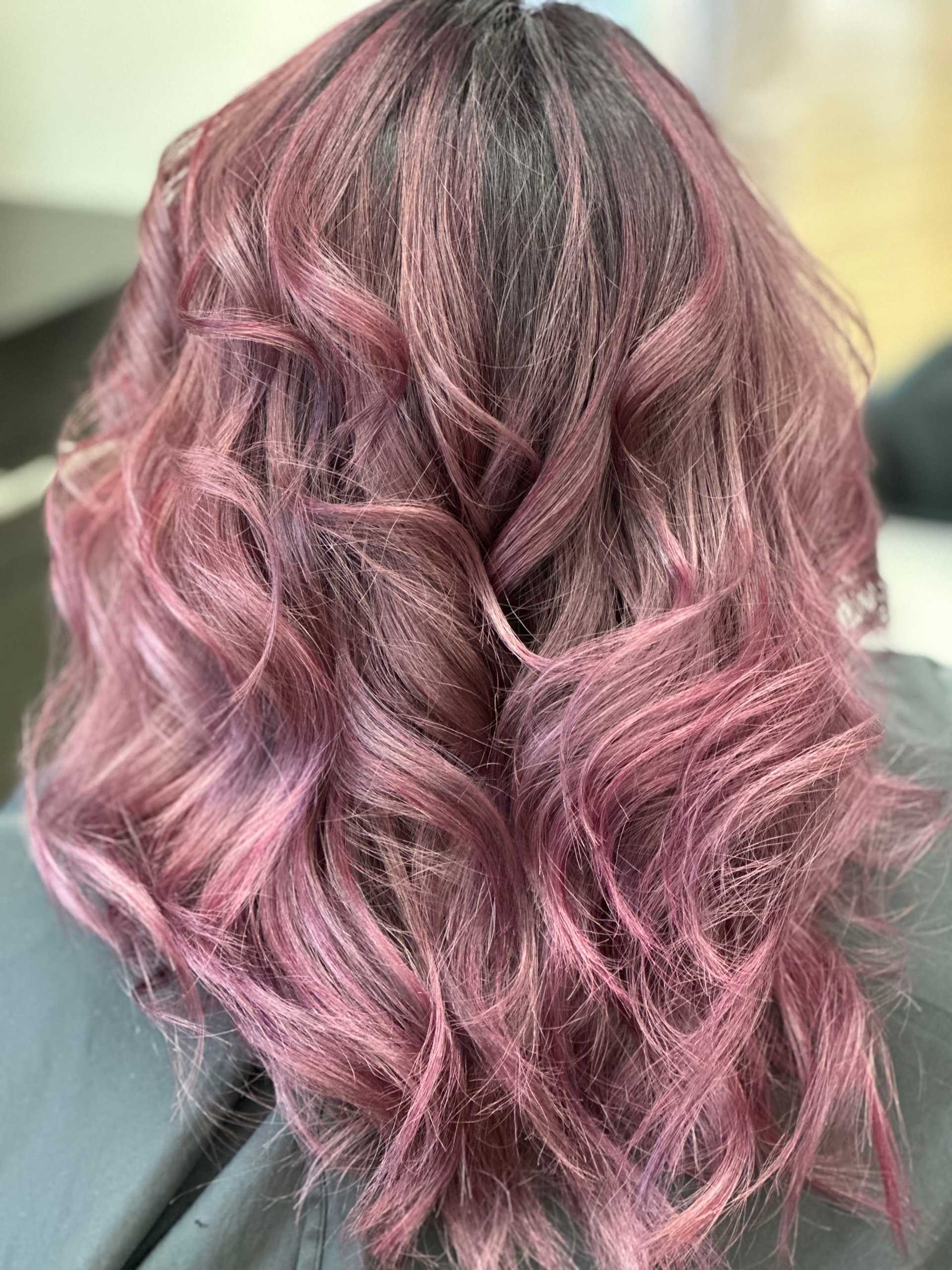 Soft pink and brown wavy hair from a back view.