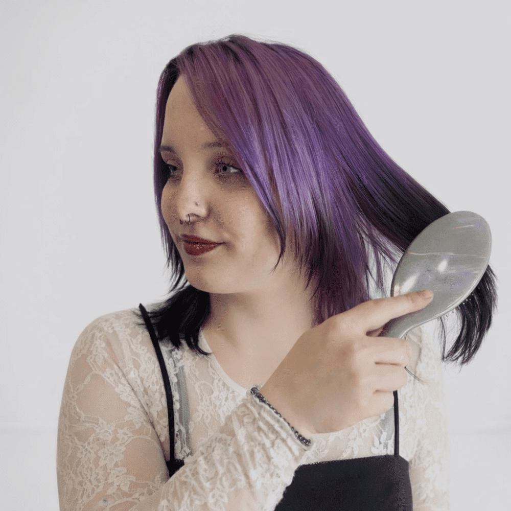 Portrait of Abby, a professional stylist at LookAfter Hair, showcasing their expertise and style.