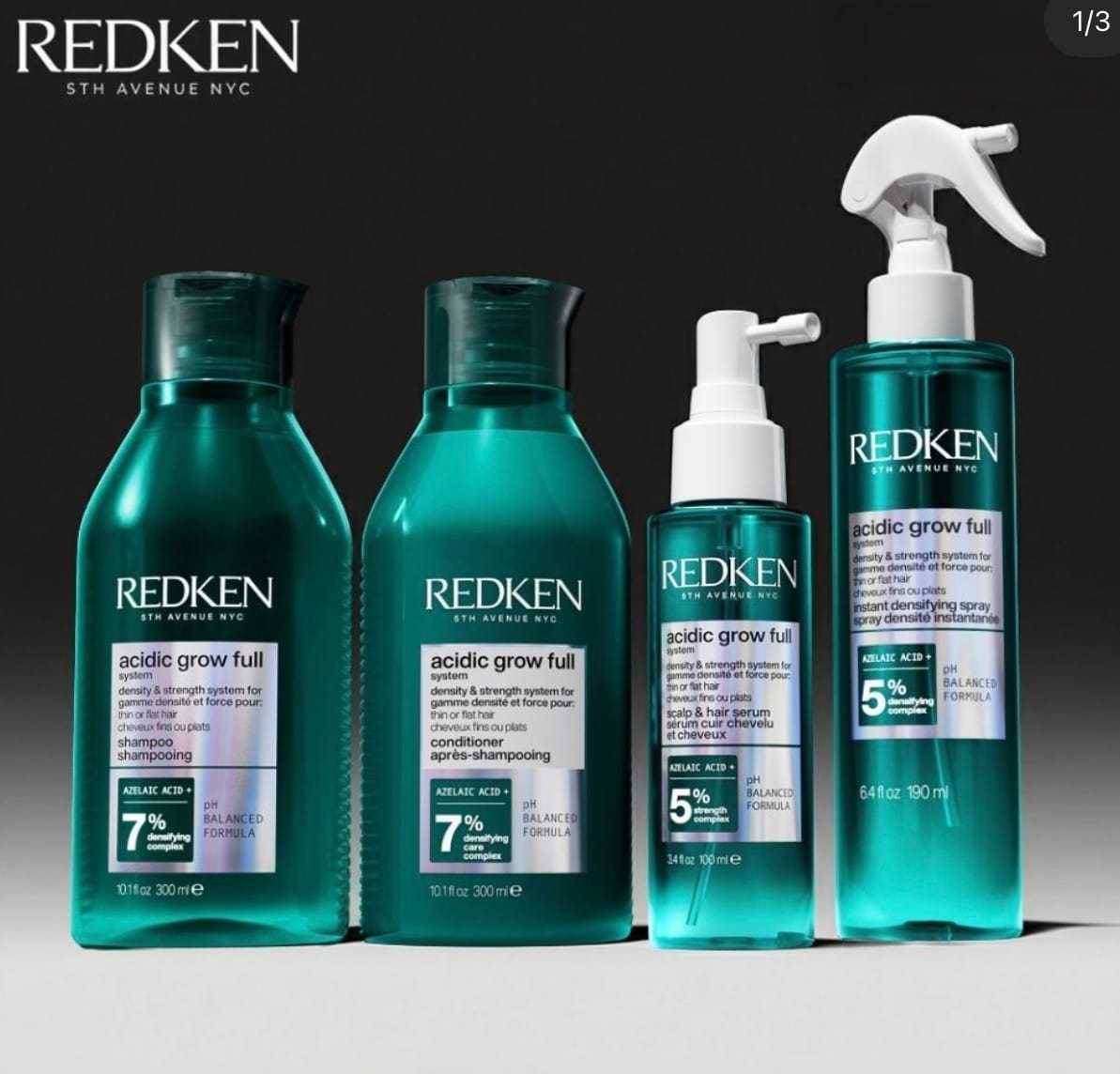 Redken haircare products for volume and strength on a dark background.
