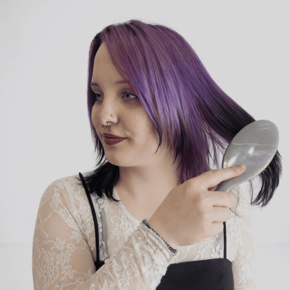 Portrait of Abby, a professional stylist at LookAfter Hair, showcasing their expertise and style.