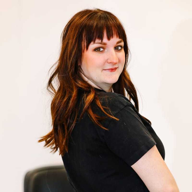 Portrait of Adeline, a professional stylist at LookAfter Hair, showcasing their expertise and style.