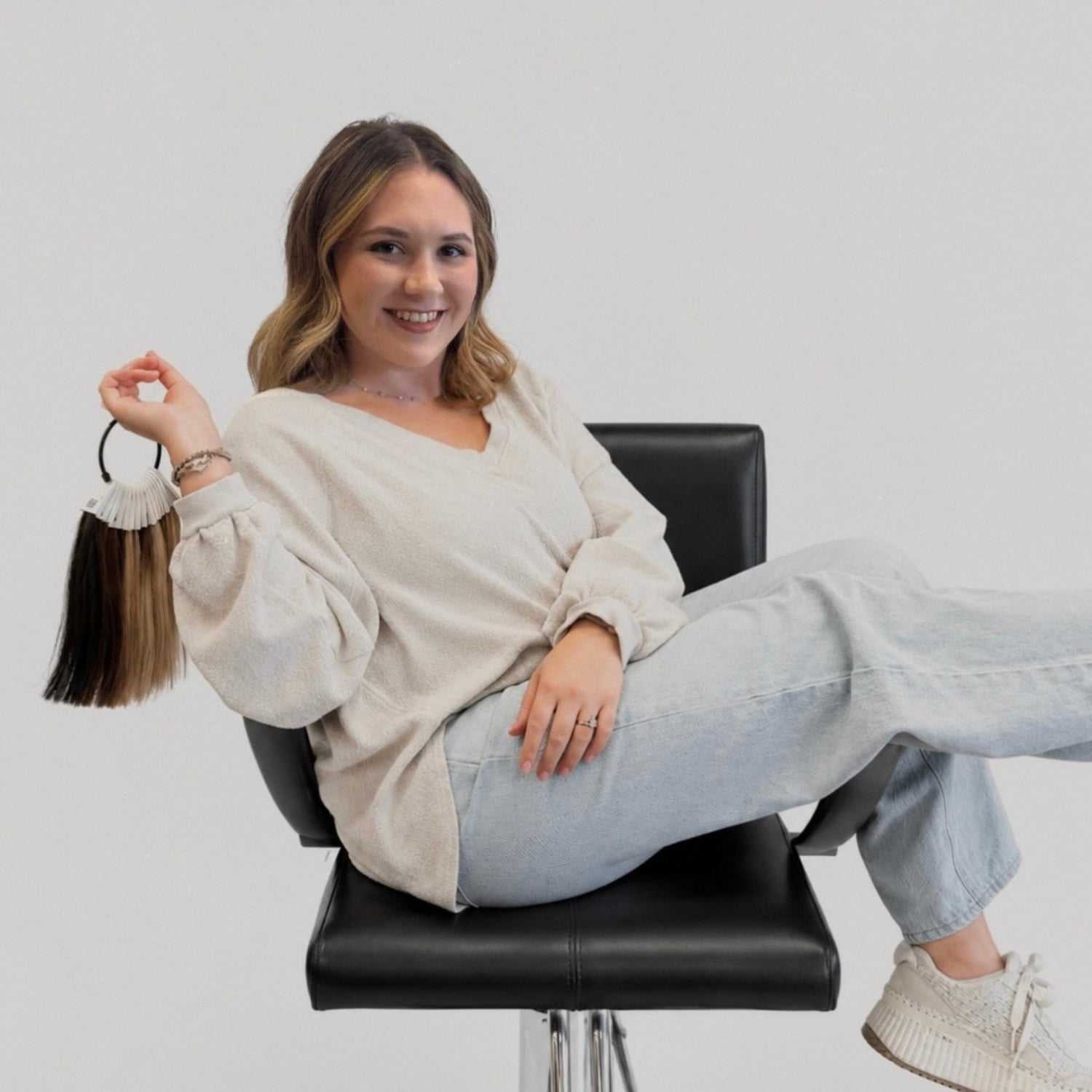 Portrait of Olivia, a professional stylist at LookAfter Hair, showcasing their expertise and style.
