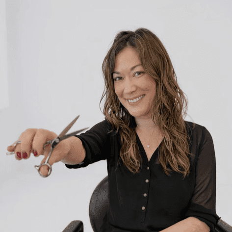 Portrait of Gina, a professional stylist at LookAfter Hair, showcasing their expertise and style.