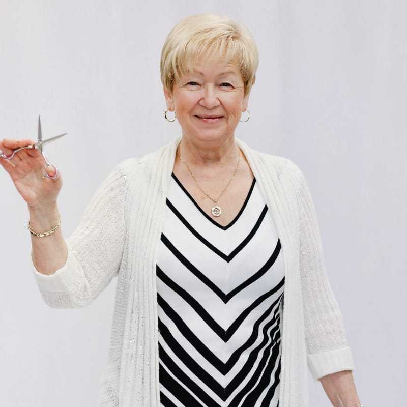 Portrait of Tayisiya, a professional stylist at LookAfter Hair, showcasing their expertise and style.