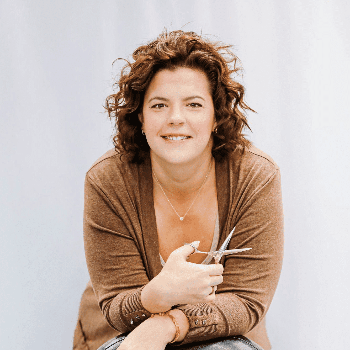 Portrait of Cindy T., a professional stylist at LookAfter Hair, showcasing their expertise and style.