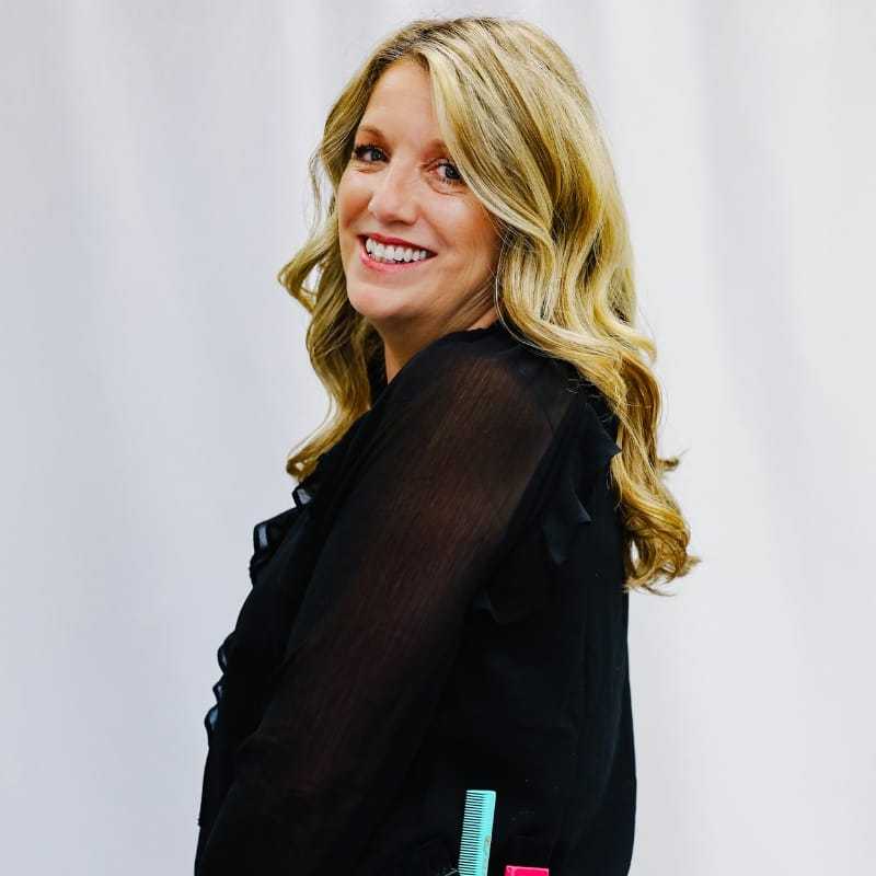 Portrait of Dwanna, a professional stylist at LookAfter Hair, showcasing their expertise and style.
