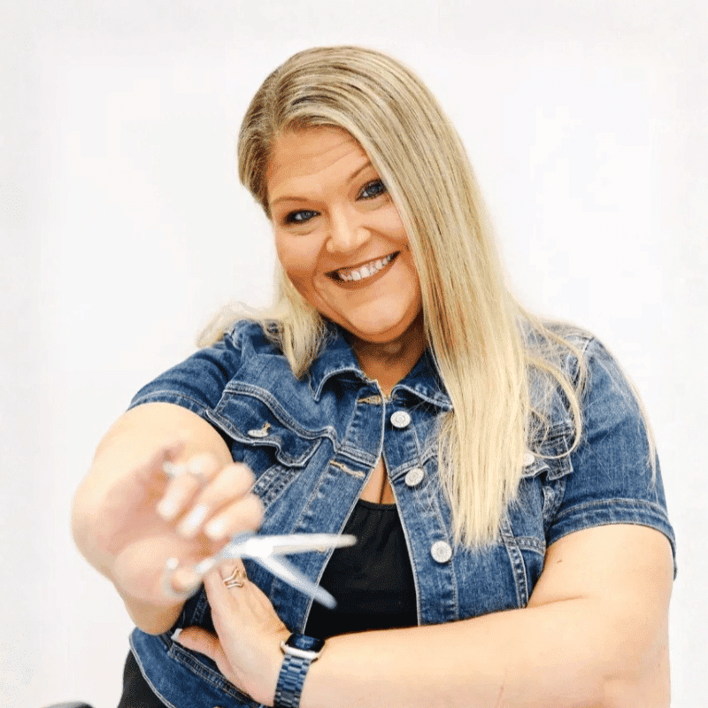 Portrait of Rowe, a professional stylist at LookAfter Hair, showcasing their expertise and style.
