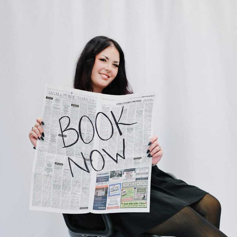 Portrait of Rachel, a professional stylist at LookAfter Hair, showcasing their expertise and style.