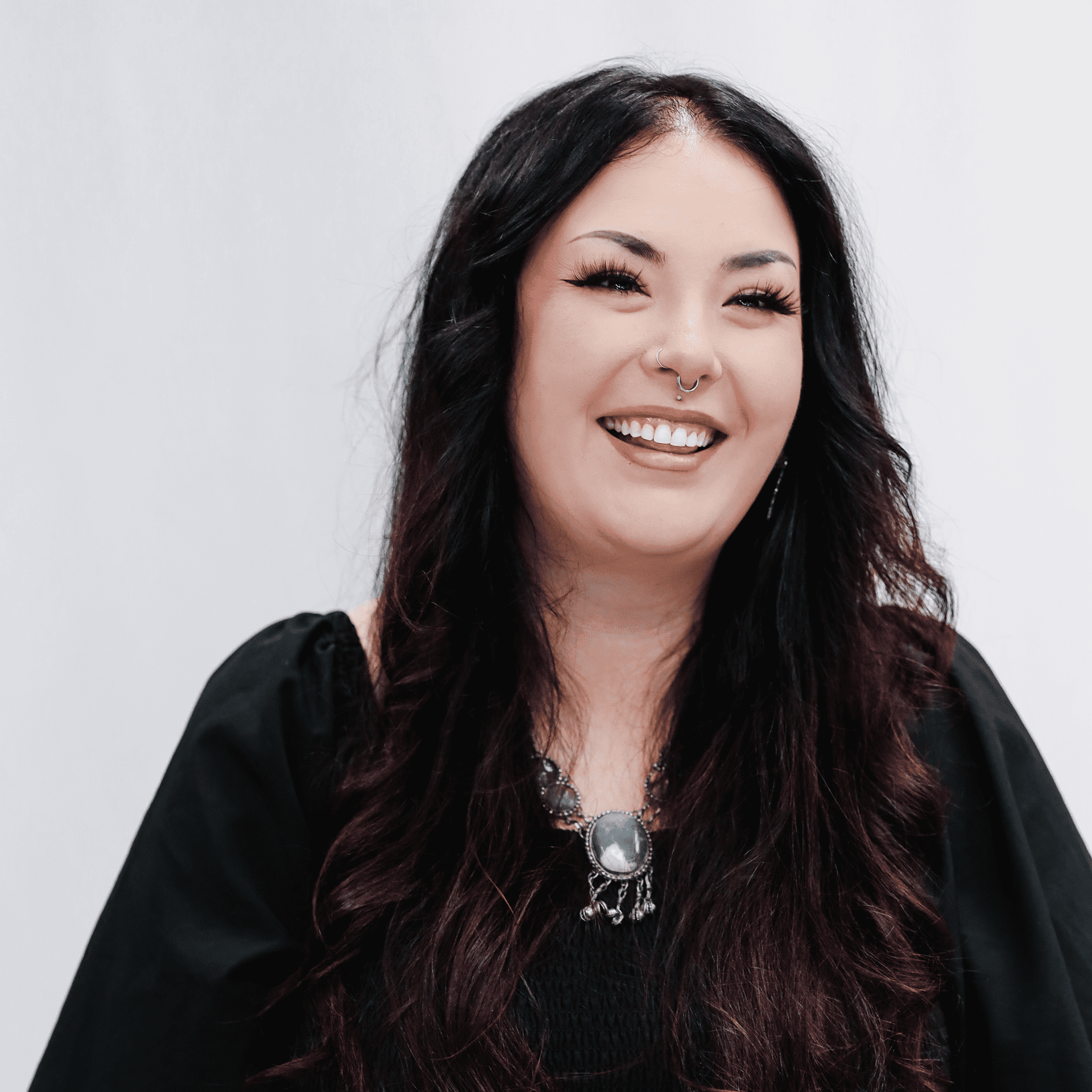 Portrait of Rachel, a professional stylist at LookAfter Hair, showcasing their expertise and style.