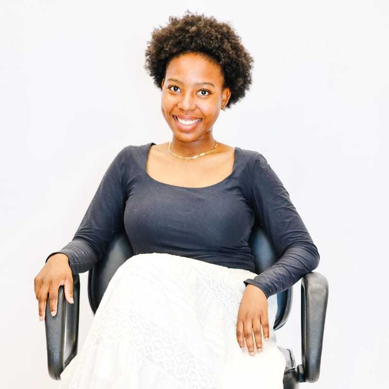 Portrait of Rosa, a professional stylist at LookAfter Hair, showcasing their expertise and style.