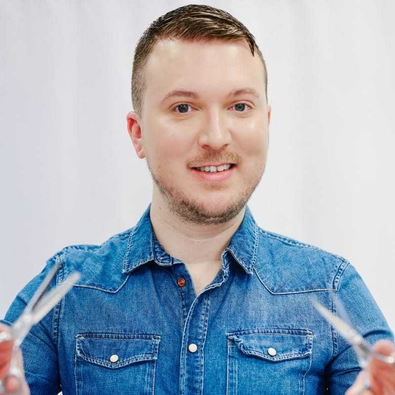 Portrait of Winston, a professional stylist at LookAfter Hair, showcasing their expertise and style.