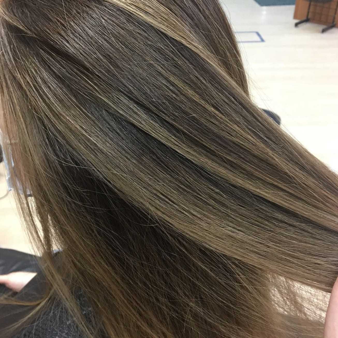 Long hair with smooth, blended brown and blonde highlights.