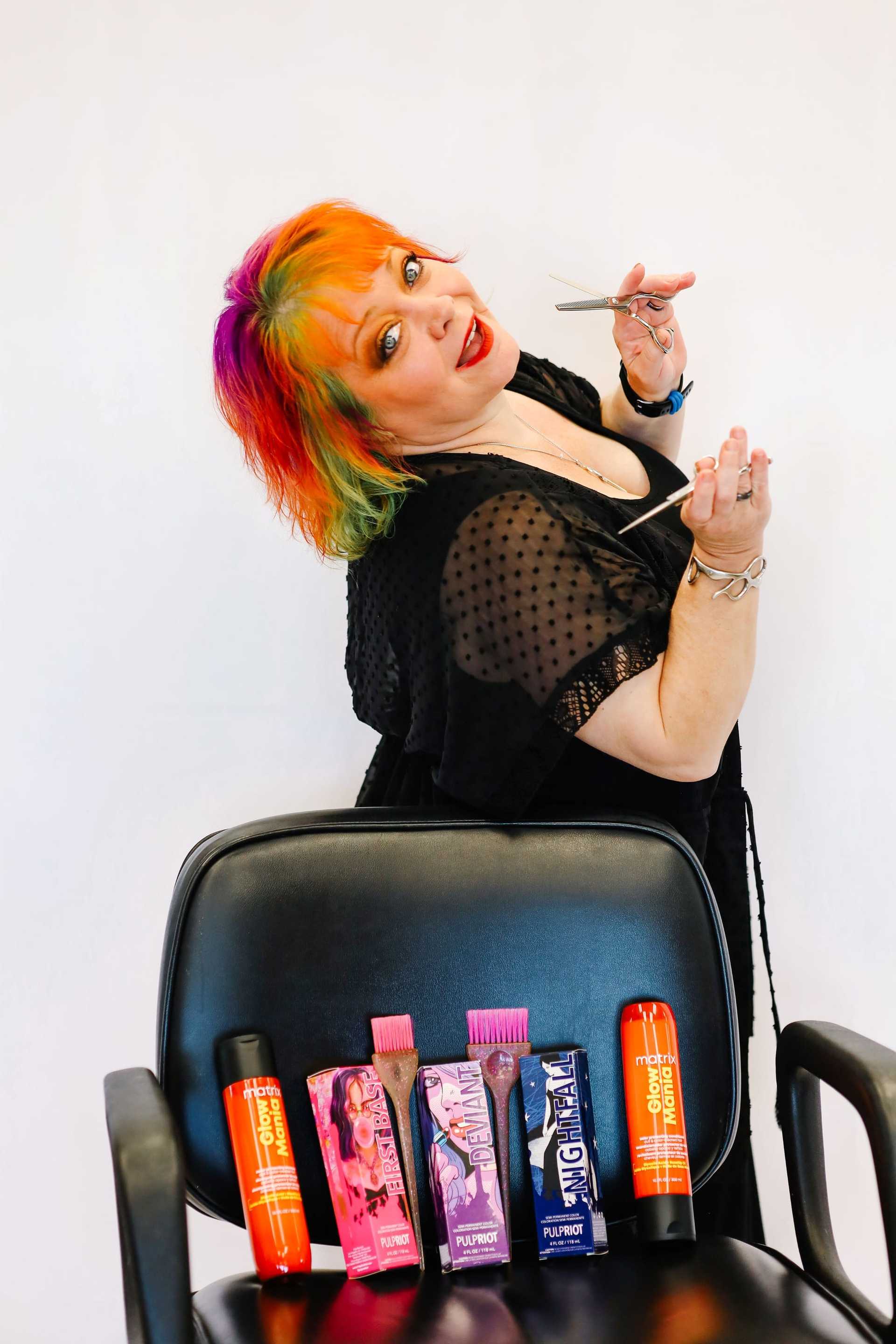 Portrait of Gypsy, a professional stylist at LookAfter Hair, showcasing their expertise and style.