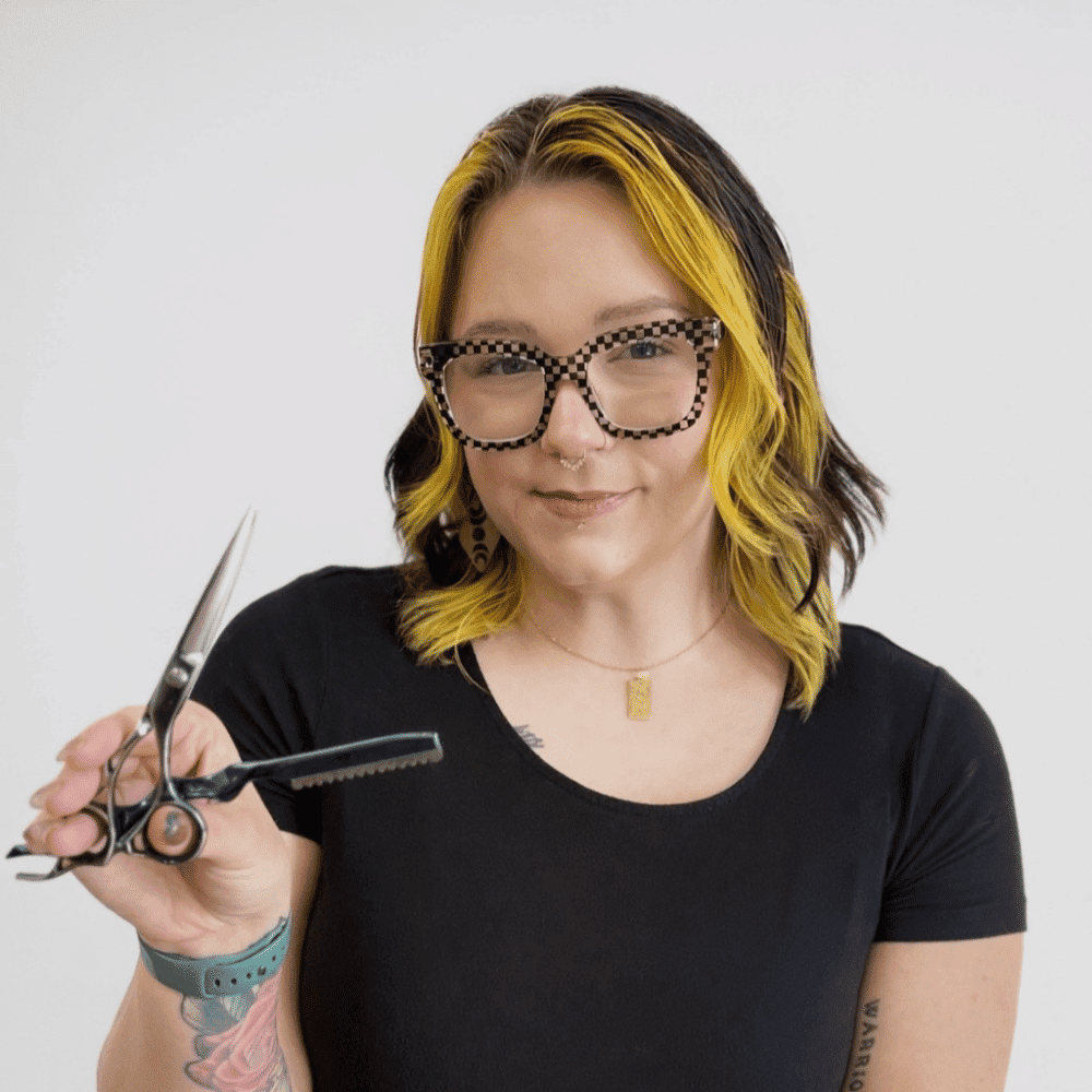 Portrait of Hayley, a professional stylist at LookAfter Hair, showcasing their expertise and style.